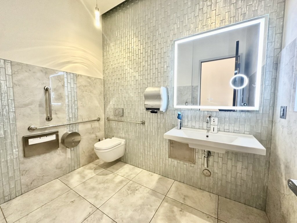 Touchless soap and towel dispensers in bathroom