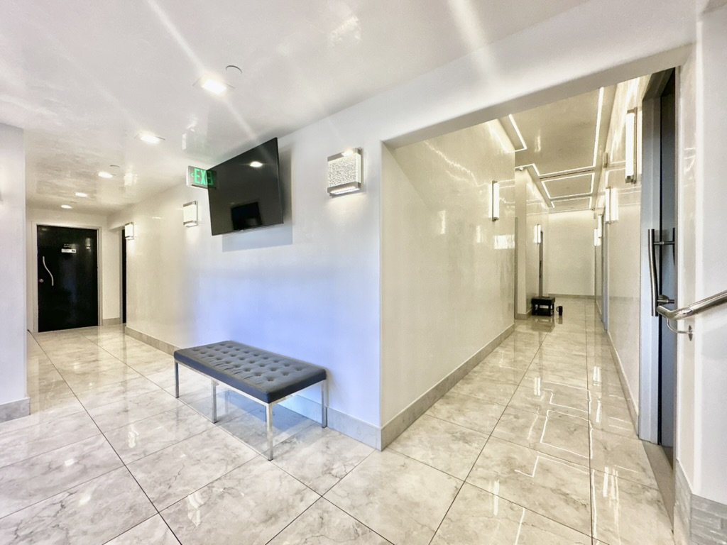 Italian marble hallway with decorative lighting